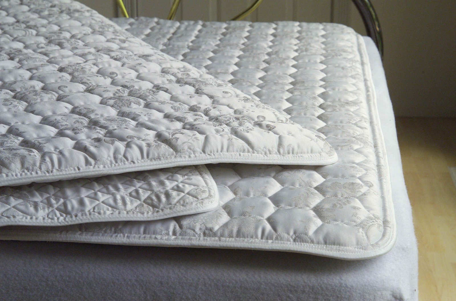 mattress pad to make hard bed soft